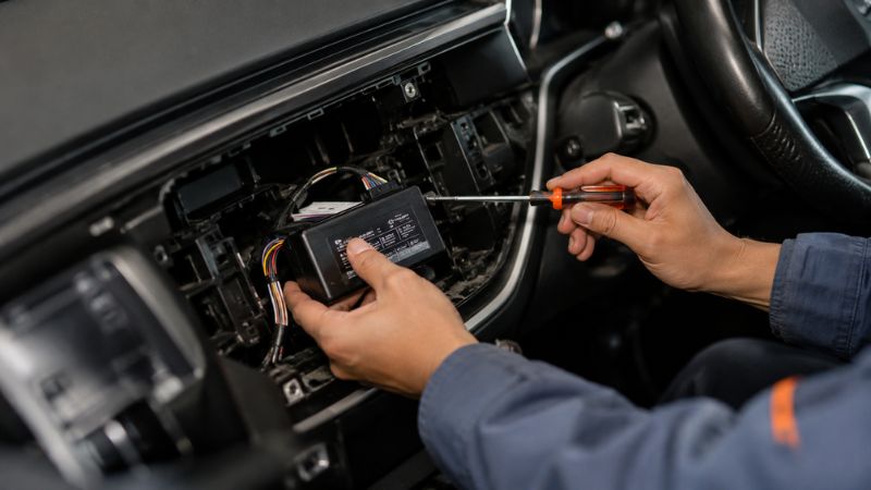 Hidden GPS tracking device installed on transport vehicle dashboard in Gujarat